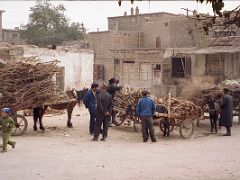 11 Kashgar Old City Street Scene 1993 Donkey Carts Being Loaded With Wood.jpg